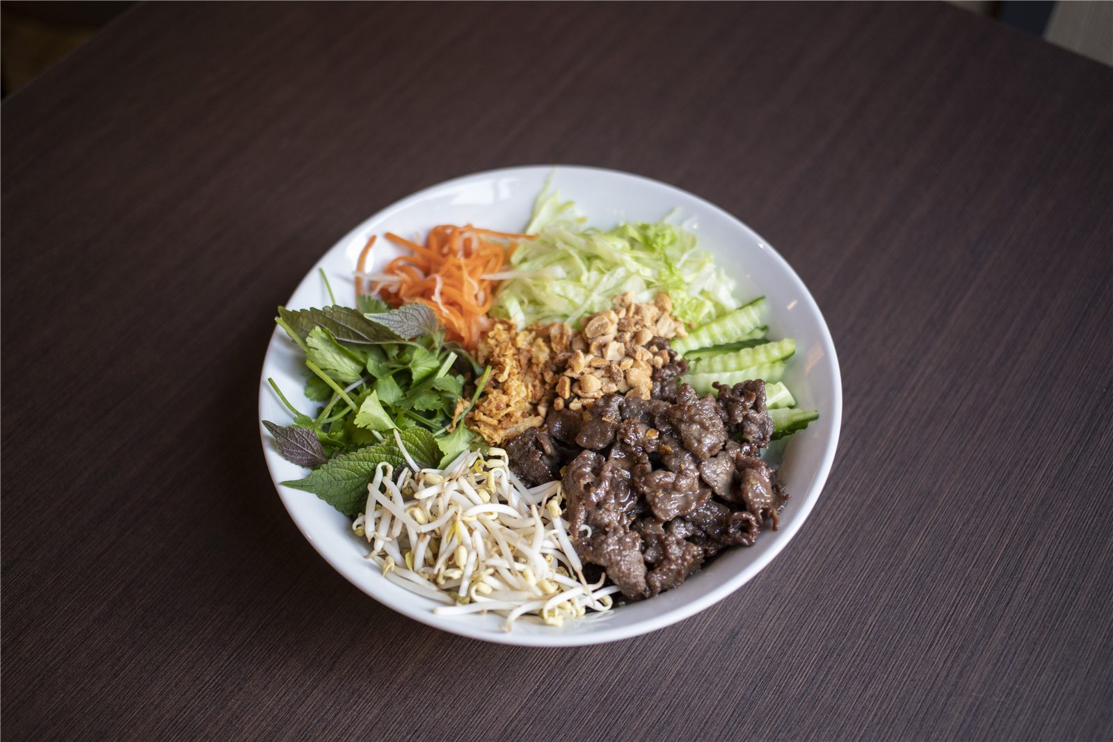Bún bò Nam Bộ with beef, peanuts and fresh vegetables