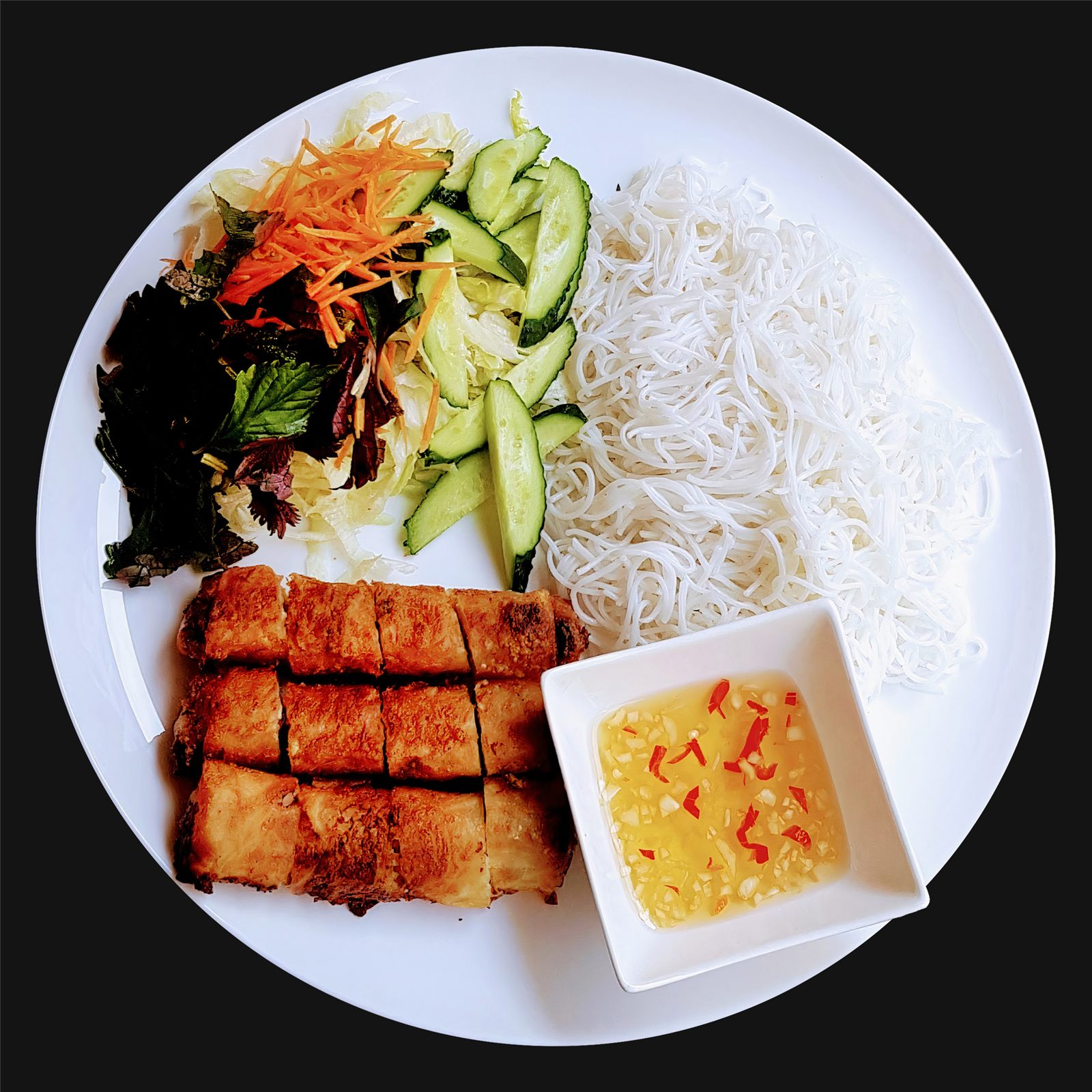 Nem rán spring rolls with rice noodles and vegetables